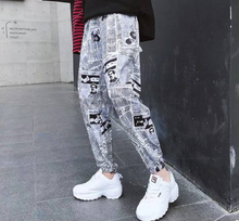 Load image into Gallery viewer, Tide brand hip hop newspaper pants men and women pants ins the same paragraph street loose beam pants national tide
